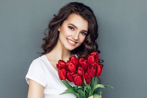 istock Beautiful woman with flowers 942179160