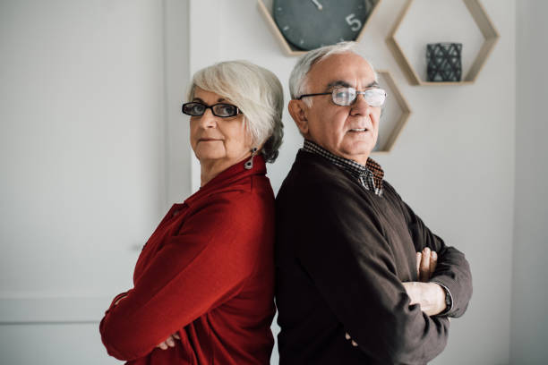 istock Senior couple standing in back to back position 942179386