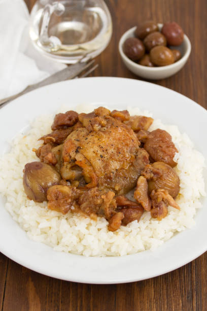 istock chicken with chestnuts and boiled rice on dish 942179552