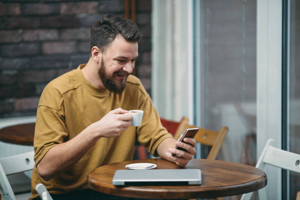 istock Young man sitting in cafe 942179606