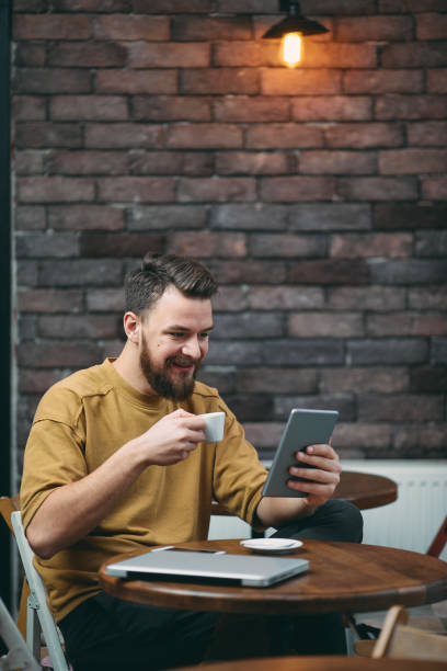 istock Young man sitting in cafe 942179724