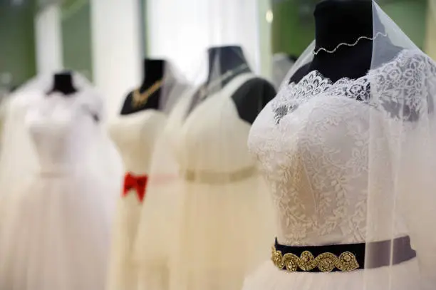 wedding dresses in bridal salon.