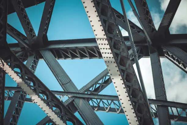 Bridge frame closeup on blue sky background. Horizontal toned image