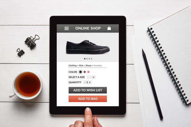 istock Online shop concept on tablet screen on white wooden table 942181676