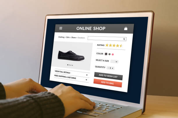istock Online shop concept on laptop computer screen on wooden table 942181678