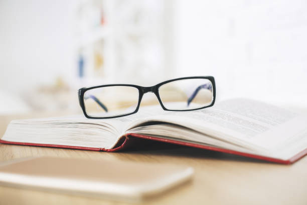 istock Glasses, book and smartphone 942182802