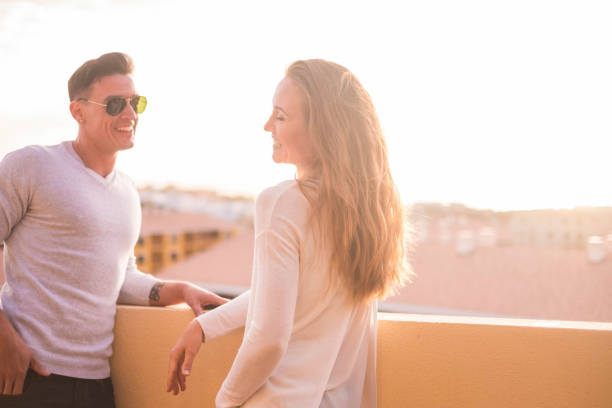 istock couple in relationship speak on the rooftop 942182948