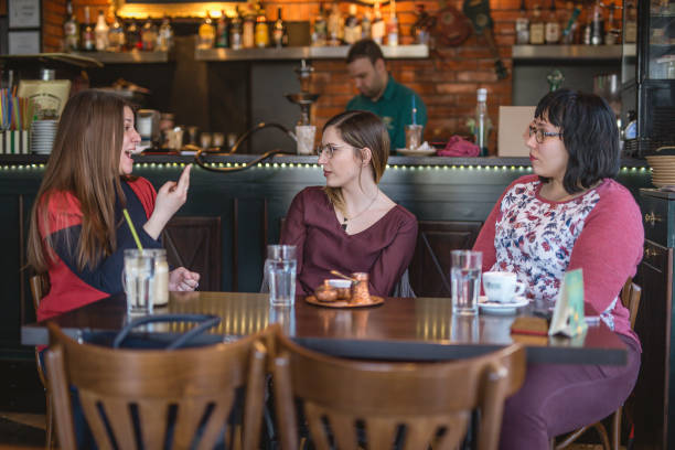 istock Women using sign language at the cafe 942183082