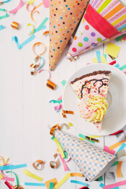istock birthday cake and  decoration on white wooden background 942183682