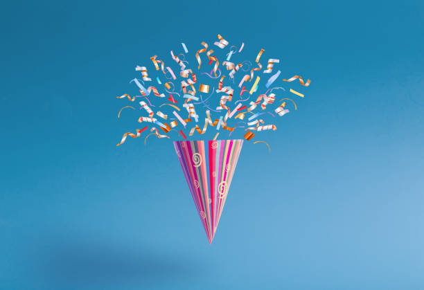 birthday hat with confetti on paper background
