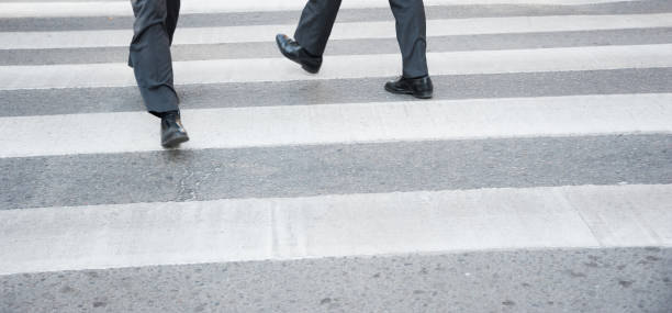 istock Suits crossing street, motion blur 942184616