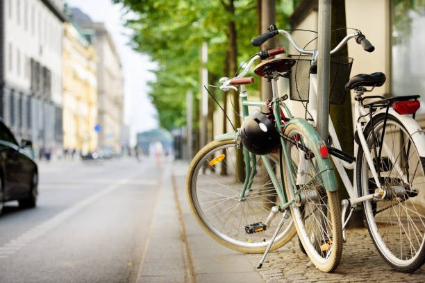Parked bikes on sidewalk in the city
