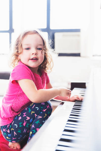 istock Playing her mother's grand piano 942185472