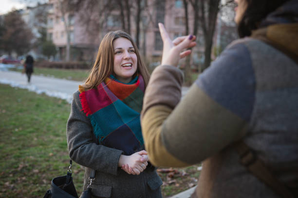 istock Talking to a friend on the street 942186490