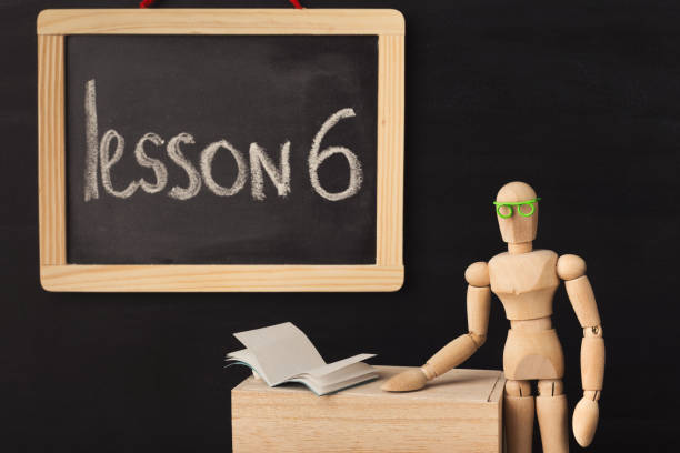 istock Lesson 6 written with chalk on blackboard. 942186962