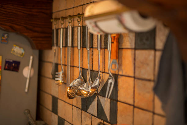 istock image of kitchen utensils hanging on the wall 942187010