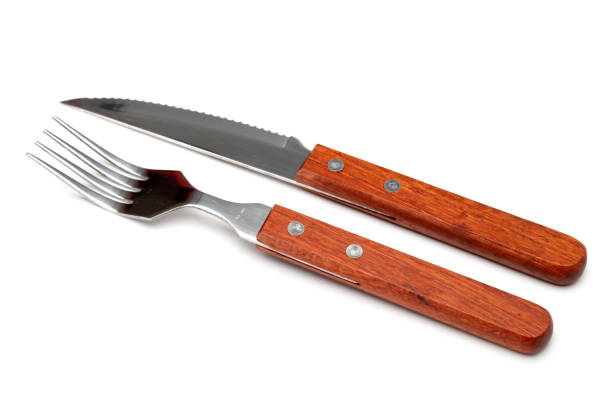 istock Wooden handle  Fork and knife  isolated on white background 942189302