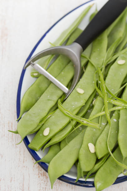 istock fresh green beans on dish on wooden background 942190322