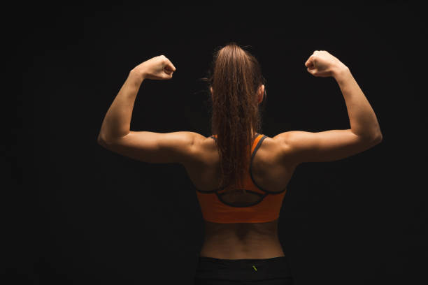 istock Athletic woman showing muscular body 942190794