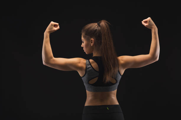 istock Athletic woman showing muscular body 942190908