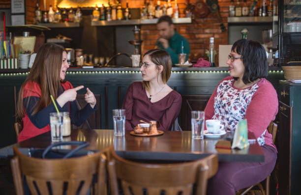 istock Three women enjoying their coffee at the cafe 942192664