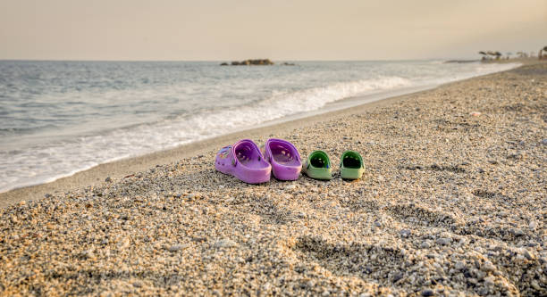 kids run to swim at beach, family on sea vacation