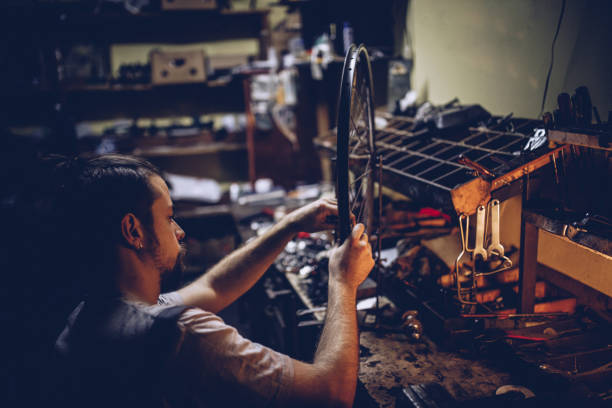 istock Man working in bike service 942195986