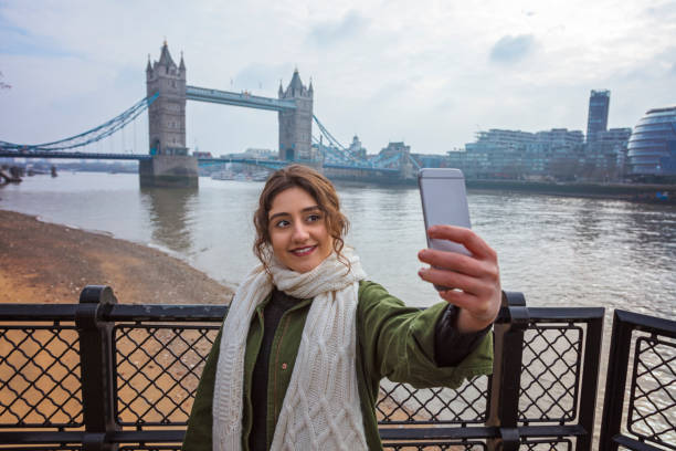 istock Young woman takes selfie at Tower Bridge 942196784