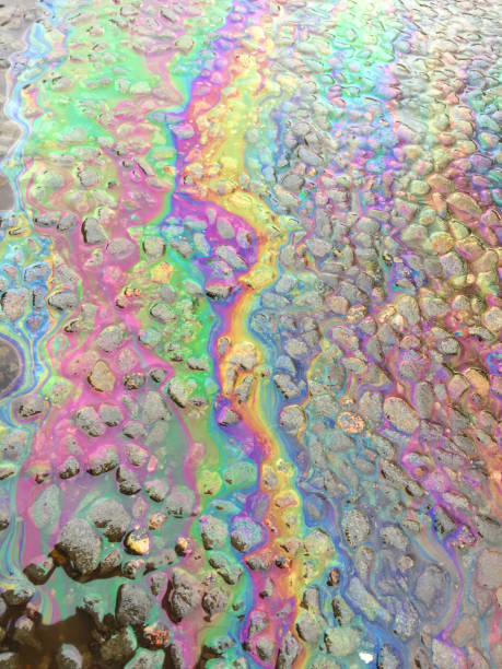 istock Oil Petrol Rainbow Leak on Pavement 942200170
