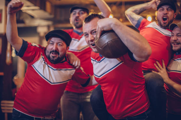istock Football fans at bar 942202078