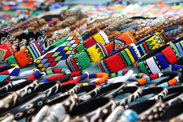 Colorful handmade bracelets, bangles at local craft market in South Africa stock photo