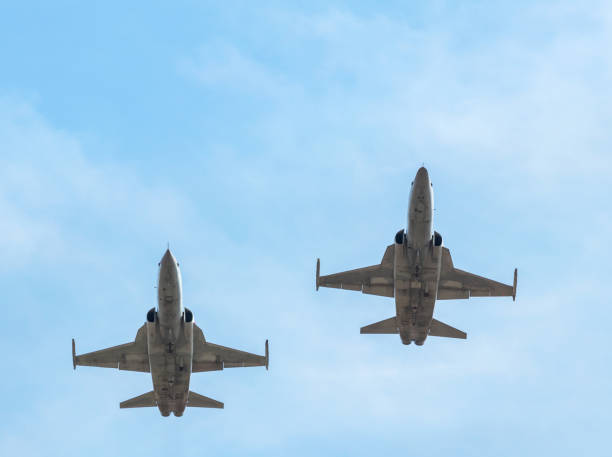 istock fighter jet military aircrafts flying on blue sky background 942204874
