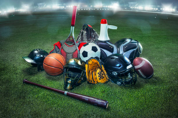 sports balls on the field with yard line. soccer ball, american football and baseball in yellow glove on green grass. outdoors - sports equipment imagens e fotografias de stock