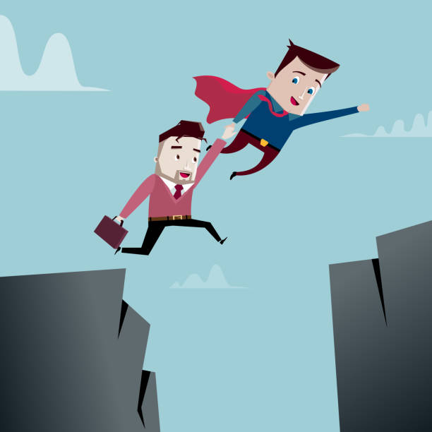 istock Superhero helps businessman jump over the cliff 942209184