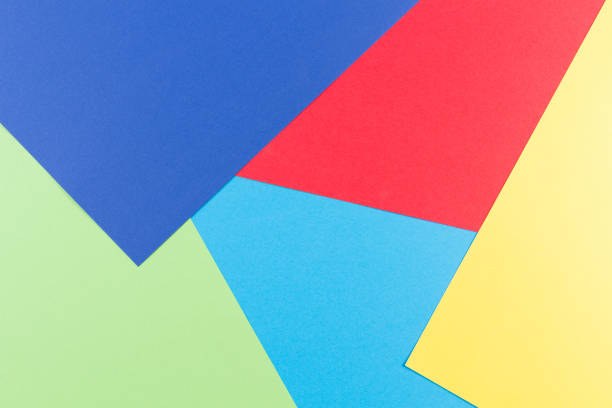 istock Color papers geometry flat composition background with yellow, green, red and blue tones 942213804