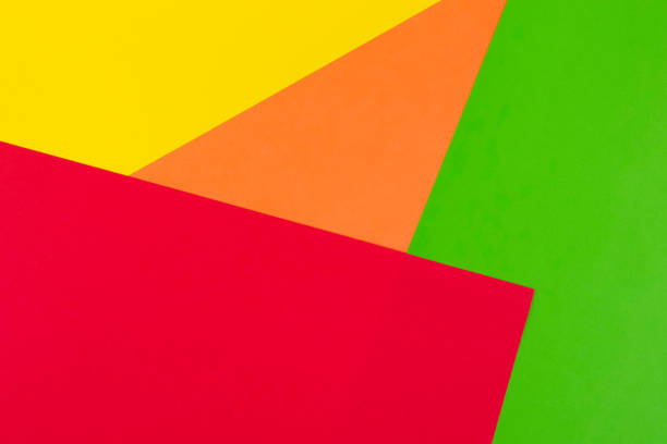 istock Yellow, red, green and orange color paper background 942214062