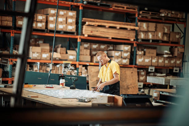 istock Diligent factory worker working morning shift in factory 942214158