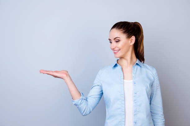 istock Successful cute young woman presenting new product 942216692