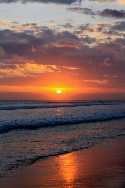Magic Dramatic Unreal Sunset in Kuta beach, Bali, Indonesia stock photo