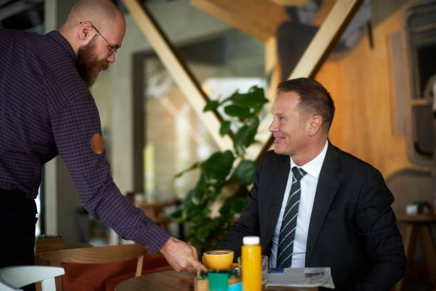 istock Waiter in coffee shop 942220898