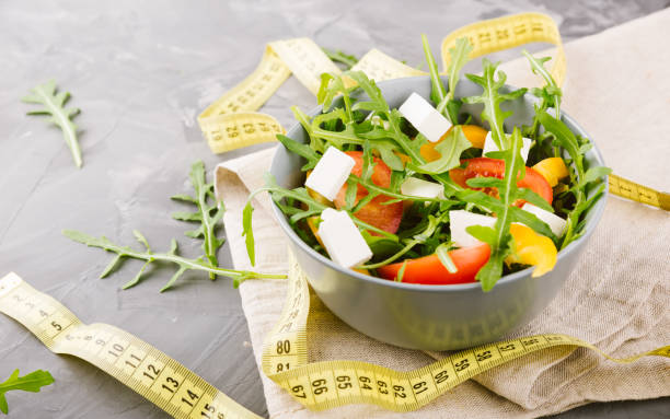 istock Salad in bowl on a grey table. 942221622