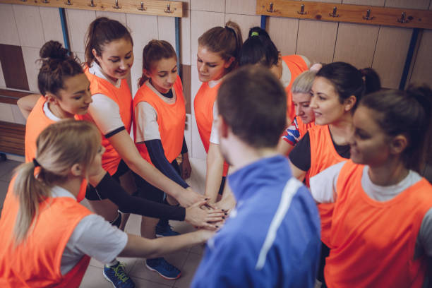 istock Coach and players huddling 942225894