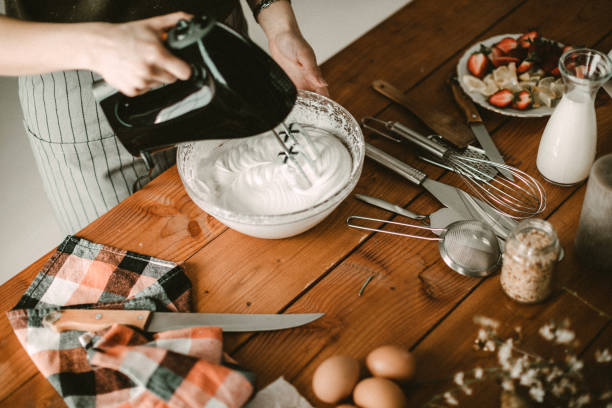 istock Young hous wife mixing wiped cream 942226198