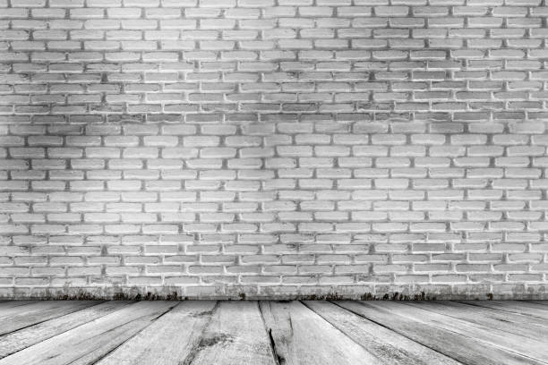 istock Abstract grunge texture background. empty room with brick wall and wood floor 942226220