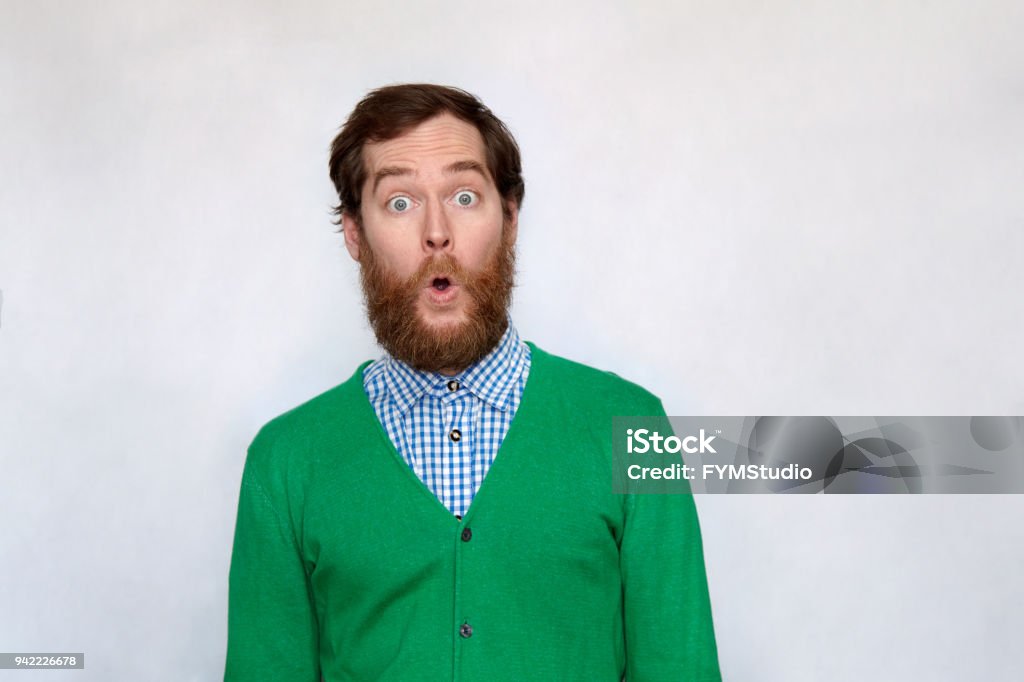 Bearded man opens his mouth in surprise Surprised man with thick beard opens his mouth and looking at camera - I can't believe it Surprise Stock Photo