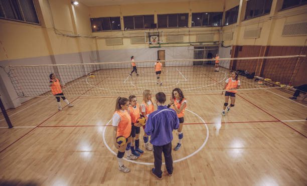 istock Coach and volleyball players making strategy 942227052