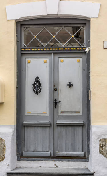 istock Grey vintage front door with glass window 942230544