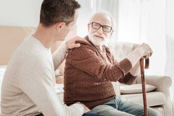 istock Calm pleasant man sitting and smiling. 942234136