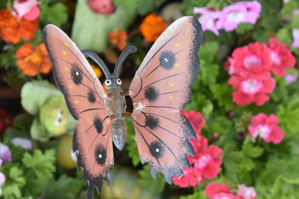 istock Model of butterfly with flowers 942234284