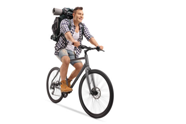 istock Tourist with a backpack riding a bicycle 942234752